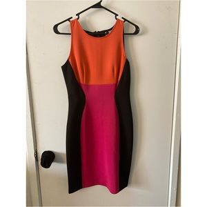 Black dress with pink and orange block design in front, size 6.